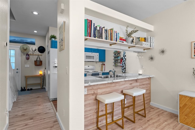 7206 Avenida El Nido, Santa Fe, NM 87507 - bar with white appliances, light wood-style flooring, and recessed lighting