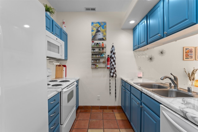 7206 Avenida El Nido, Santa Fe, NM 87507 - kitchen with white appliances, blue cabinets, and light countertops