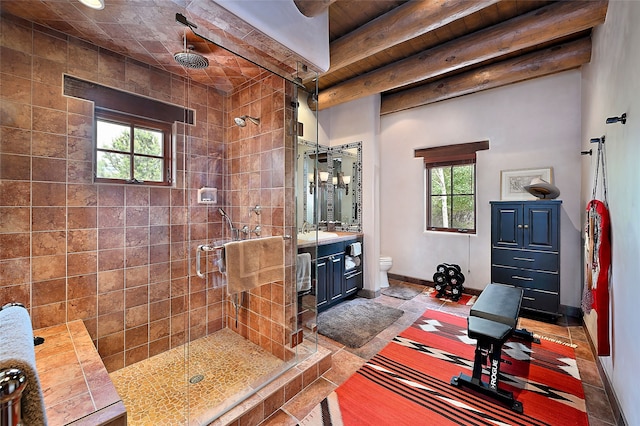 95 Lodge Trl, Santa Fe, NM 87506 - bathroom featuring a stall shower, healthy amount of natural light, vanity, and a wood ceiling with exposed beams