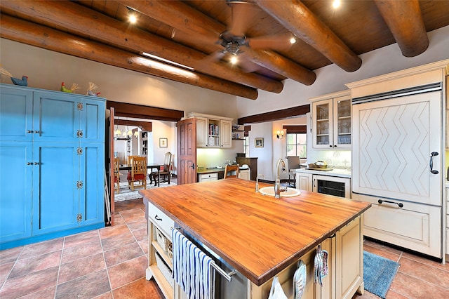 95 Lodge Trl, Santa Fe, NM 87506 - kitchen featuring butcher block countertops, a wooden ceiling with exposed beams, blue cabinets, a ceiling fan, and open shelves