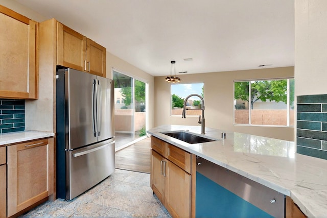5 Wood Flower, Santa Fe, NM 87508 - kitchen with freestanding refrigerator, healthy amount of natural light, light stone counters, and tasteful backsplash