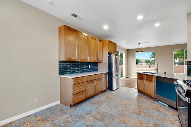 5 Wood Flower, Santa Fe, NM 87508 - kitchen featuring appliances with stainless steel finishes, light countertops, plenty of natural light, tasteful backsplash, and recessed lighting