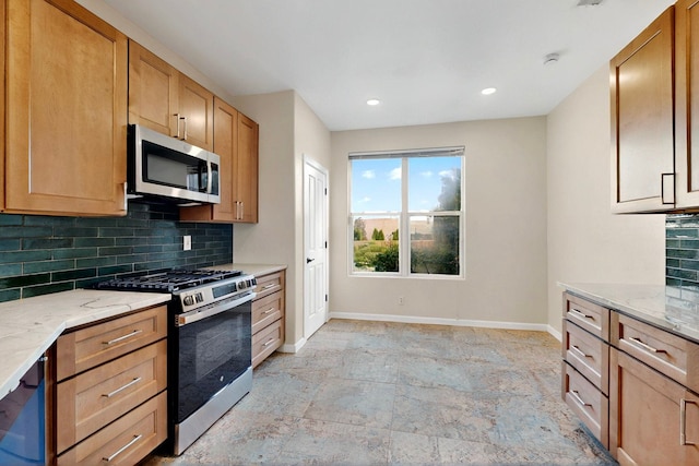 5 Wood Flower, Santa Fe, NM 87508 - kitchen featuring appliances with stainless steel finishes, tasteful backsplash, light stone finish floors, light stone counters, and recessed lighting