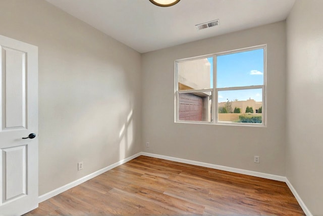 5 Wood Flower, Santa Fe, NM 87508 - spare room with wood finished floors
