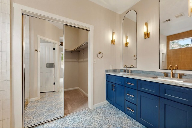 5 Wood Flower, Santa Fe, NM 87508 - full bath featuring double vanity, a spacious closet, and tile patterned flooring