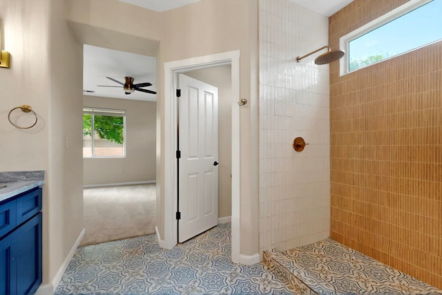 5 Wood Flower, Santa Fe, NM 87508 - bathroom featuring healthy amount of natural light, tiled shower, a ceiling fan, and vanity