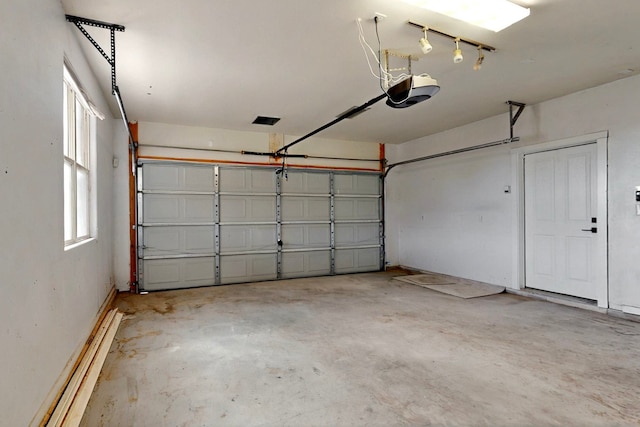 5 Wood Flower, Santa Fe, NM 87508 - garage featuring a garage door opener