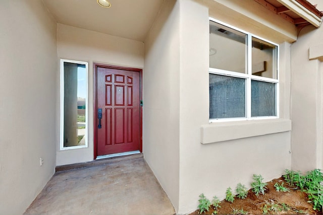 5 Wood Flower, Santa Fe, NM 87508 - doorway to property featuring stucco siding