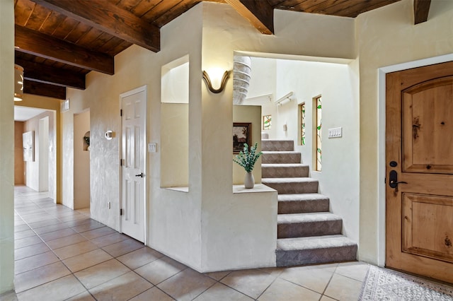 3046 Plaza Blanca, Santa Fe, NM 87507 - foyer entrance with a wood ceiling with exposed beams, light tile patterned floors, and stairway
