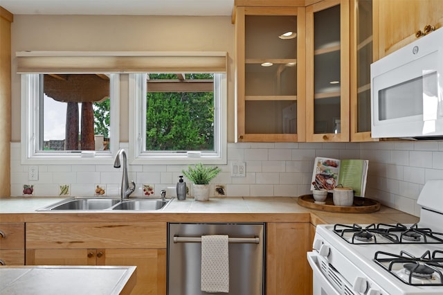 3046 Plaza Blanca, Santa Fe, NM 87507 - kitchen with white appliances, light countertops, decorative backsplash, and glass insert cabinets