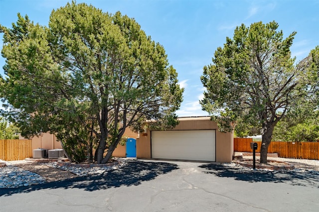 3046 Plaza Blanca, Santa Fe, NM 87507 - obstructed view of property featuring an attached garage