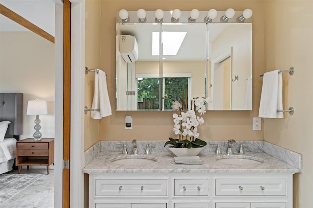 3046 Plaza Blanca, Santa Fe, NM 87507 - bathroom featuring an AC wall unit and double vanity