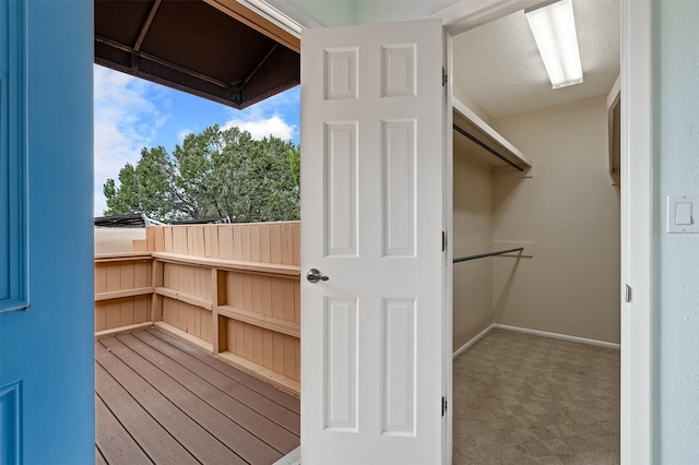 3046 Plaza Blanca, Santa Fe, NM 87507 - walk in closet featuring wood finished floors