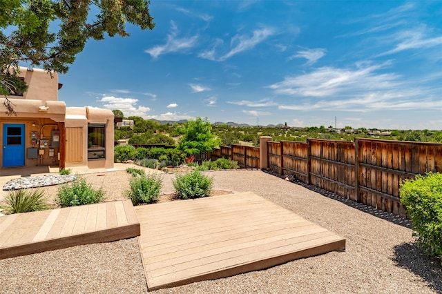 3046 Plaza Blanca, Santa Fe, NM 87507 - wooden deck featuring a fenced backyard
