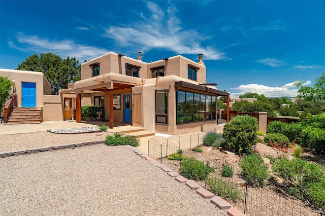 3046 Plaza Blanca, Santa Fe, NM 87507 - pueblo revival-style home featuring stucco siding