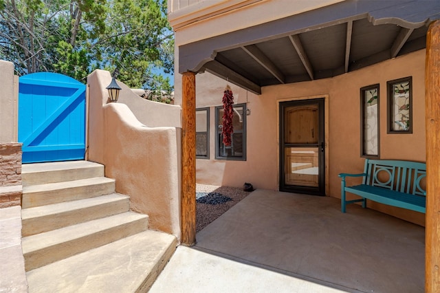 3046 Plaza Blanca, Santa Fe, NM 87507 - property entrance featuring stucco siding and a gate