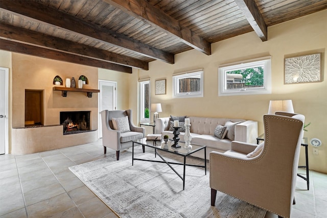 3046 Plaza Blanca, Santa Fe, NM 87507 - tiled living room with a wooden ceiling with exposed beams and a fireplace