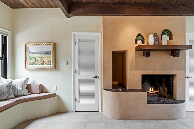 3046 Plaza Blanca, Santa Fe, NM 87507 - tiled living area with a wood ceiling with exposed beams and a fireplace