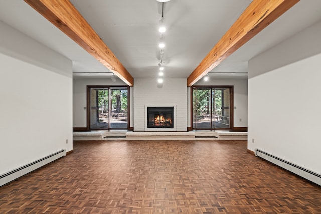 320 Valle Del Sol, White Rock, NM 87547 - unfurnished living room with a baseboard radiator, a brick fireplace, plenty of natural light, and beam ceiling