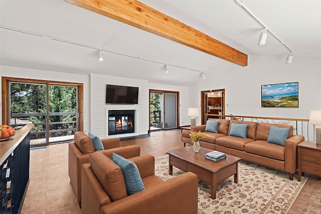 320 Valle Del Sol, White Rock, NM 87547 - living area with track lighting, a fireplace, and beam ceiling