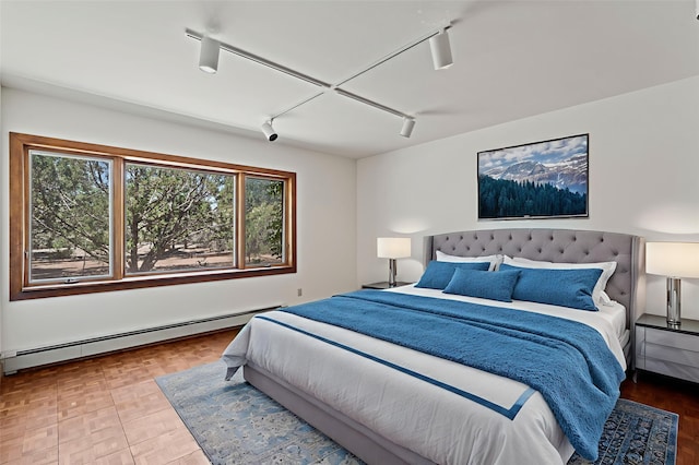 320 Valle Del Sol, White Rock, NM 87547 - bedroom with a baseboard heating unit and track lighting