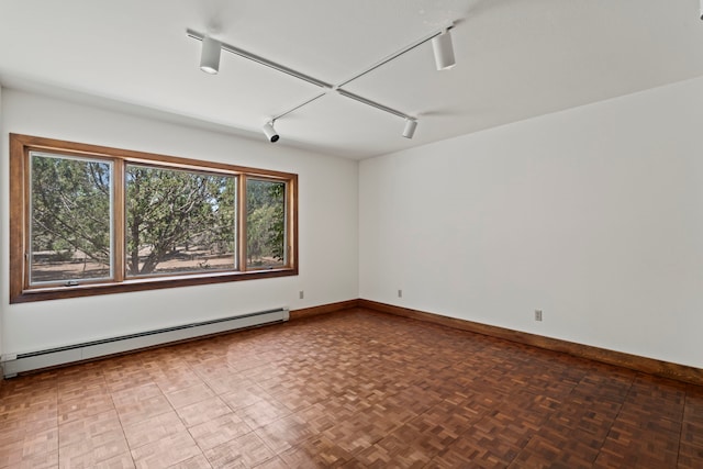 320 Valle Del Sol, White Rock, NM 87547 - spare room with a baseboard heating unit and track lighting