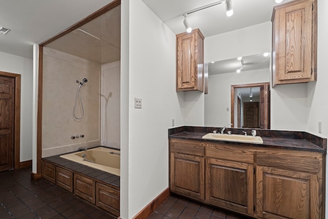 320 Valle Del Sol, White Rock, NM 87547 - full bathroom with track lighting, tile patterned floors, vanity, and shower / tub combination