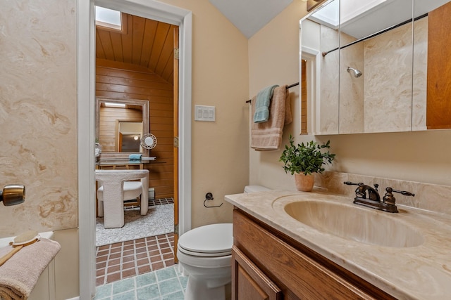 620 Navajo, Los Alamos, NM 87544 - bathroom featuring vanity, wooden walls, tile patterned floors, and lofted ceiling