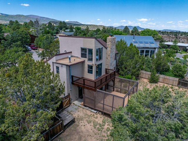 620 Navajo, Los Alamos, NM 87544 - rear view of house with stucco siding, a chimney, and a mountain view