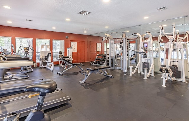 941 Calle Mejia Unit 413, Santa Fe, NM 87501 - gym with healthy amount of natural light, recessed lighting, and a textured ceiling