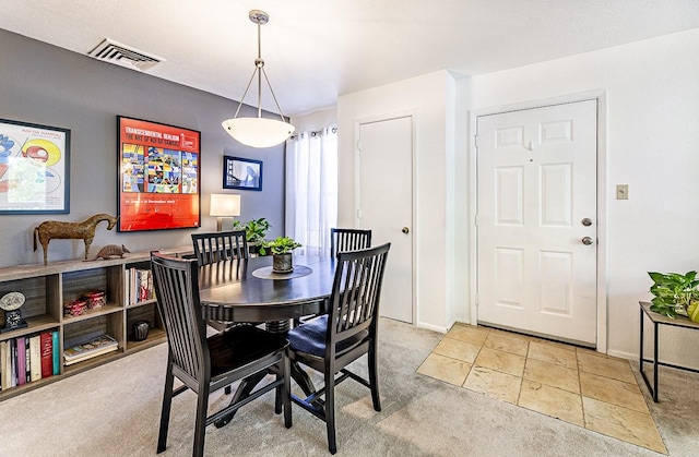 941 Calle Mejia Unit 413, Santa Fe, NM 87501 - dining area featuring carpet flooring and baseboards