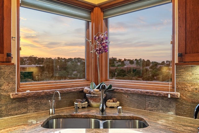 19 Camino Don Carlos, Santa Fe, NM 87506 - kitchen view of dark stone counters and decorative backsplash