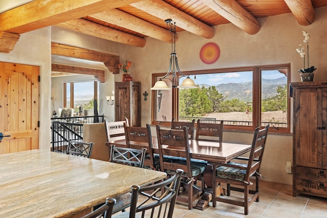 19 Camino Don Carlos, Santa Fe, NM 87506 - dining room with a wooden ceiling with exposed beams, a mountain view, and light tile patterned floors