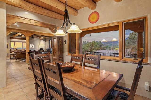 19 Camino Don Carlos, Santa Fe, NM 87506 - dining room featuring light tile patterned flooring and a wooden ceiling with exposed beams