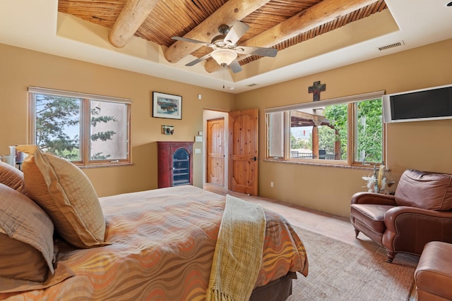 19 Camino Don Carlos, Santa Fe, NM 87506 - bedroom with a wooden ceiling with exposed beams, a tray ceiling, tile patterned floors, and a ceiling fan
