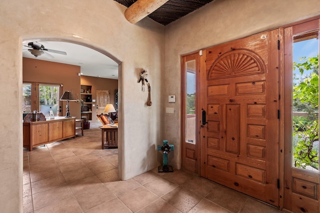 19 Camino Don Carlos, Santa Fe, NM 87506 - entryway featuring arched walkways, ceiling fan, and light tile patterned floors