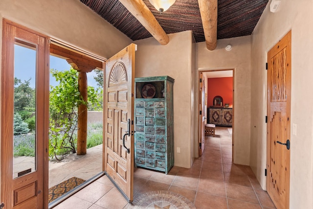 19 Camino Don Carlos, Santa Fe, NM 87506 - entrance foyer with a wood ceiling with exposed beams and light tile patterned flooring