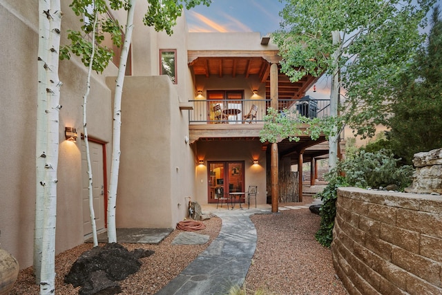 19 Camino Don Carlos, Santa Fe, NM 87506 - back of property with a balcony, french doors, and stucco siding