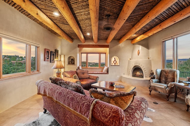 19 Camino Don Carlos, Santa Fe, NM 87506 - tiled living room featuring a wood ceiling with exposed beams and a fireplace