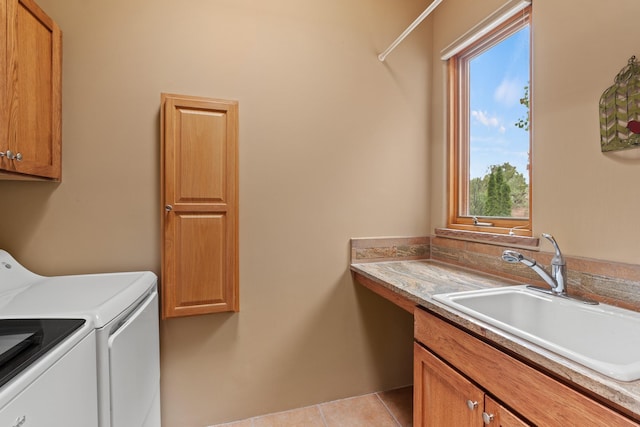 19 Camino Don Carlos, Santa Fe, NM 87506 - washroom featuring cabinet space, washer and clothes dryer, plenty of natural light, and light tile patterned flooring