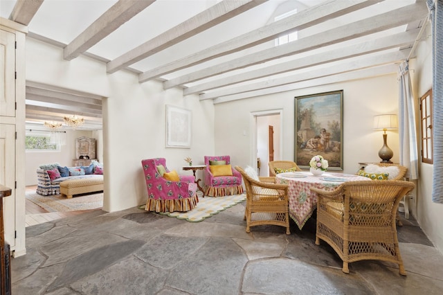 46 Sibley, Santa Fe, NM 87508 - dining space with beamed ceiling, a chandelier, and stone finish flooring
