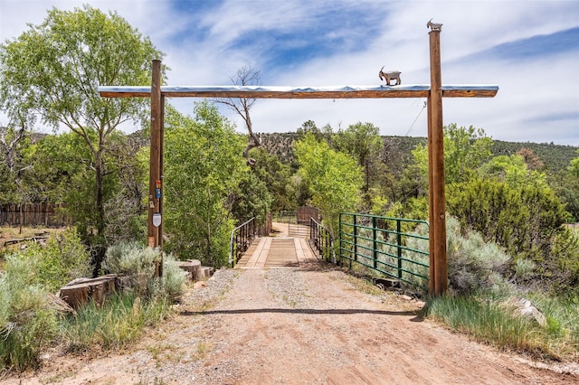 46 Sibley, Santa Fe, NM 87508 - gate with a view of trees