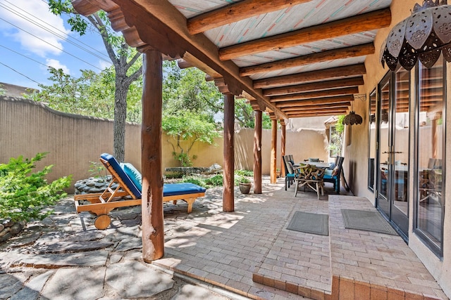 234 Ambrosio Unit A, Santa Fe, NM 87501 - fenced backyard featuring french doors, a patio area, and outdoor dining area