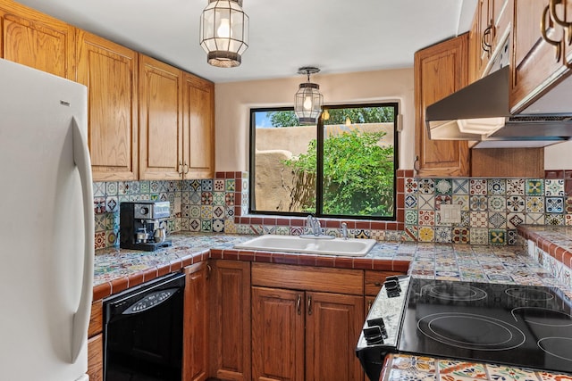 234 Ambrosio Unit A, Santa Fe, NM 87501 - kitchen featuring freestanding refrigerator, black dishwasher, electric range, decorative backsplash, and brown cabinetry