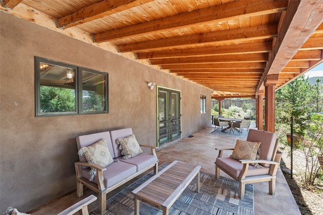 520 Este Es Rd, Taos, NM 87571 - view of patio featuring an outdoor hangout area, outdoor dining area, and french doors
