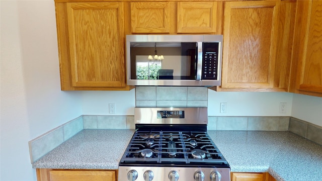 310 Grand Cyn, White Rock, NM 87547 - kitchen featuring appliances with stainless steel finishes and a chandelier