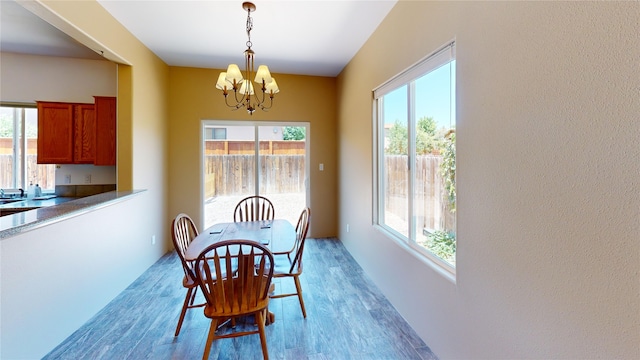 310 Grand Cyn, White Rock, NM 87547 - dining area with a chandelier and light wood-style flooring