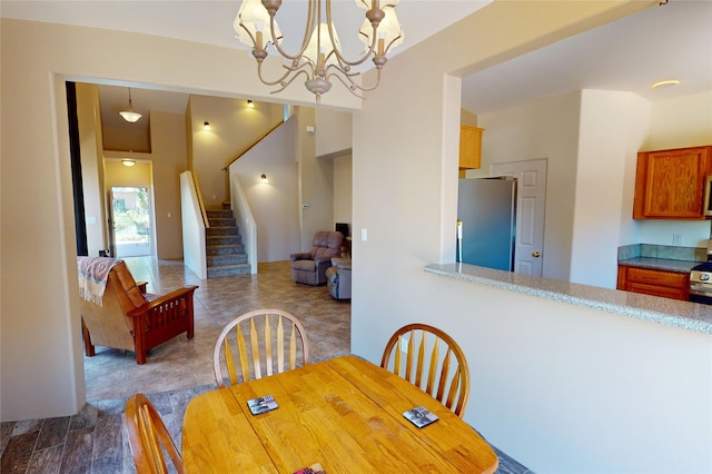 310 Grand Cyn, White Rock, NM 87547 - dining room featuring stairs, a chandelier, and tile patterned floors