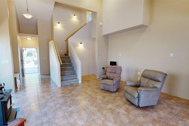 310 Grand Cyn, White Rock, NM 87547 - living area featuring a towering ceiling, stairs, and light tile patterned flooring