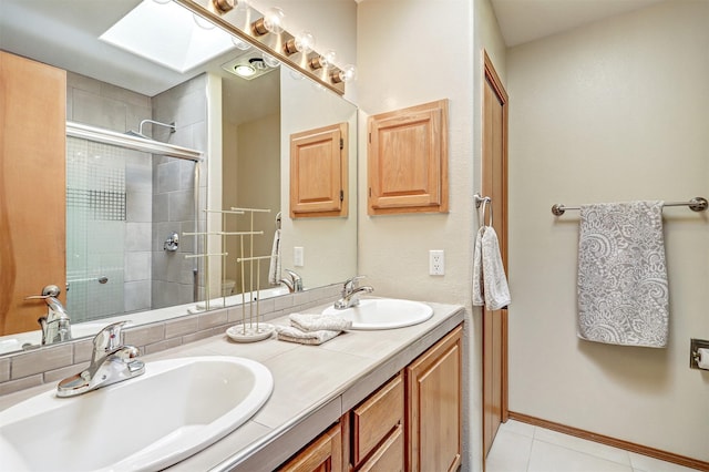 10 Carlito Rd, Santa Fe, NM 87508 - full bathroom featuring double vanity, tiled shower, tile patterned flooring, and a skylight